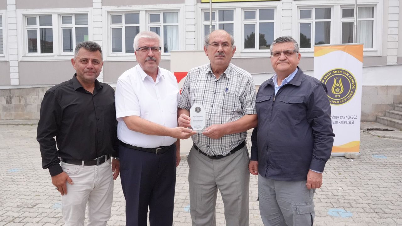 OSMAN AKSU’YA ANLAMLI PLAKET